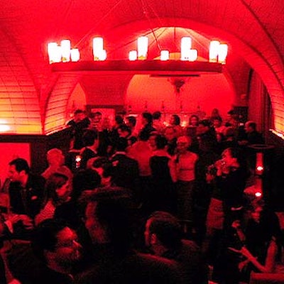 The lights on Cellar Bar's medieval-style chandeliers were covered in red, and the entire space was bathed in red light.