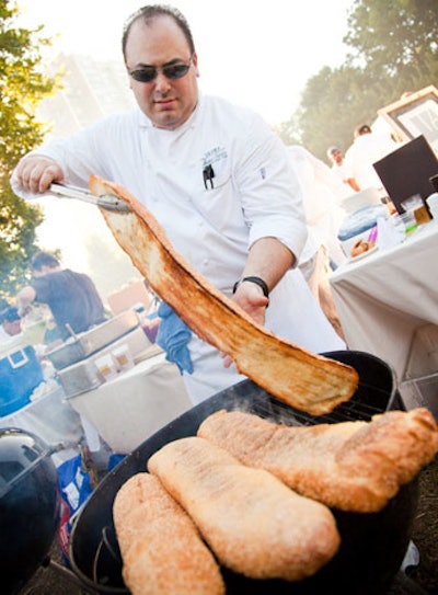 Chefs from Sixteen at the Trump Tower Chicago grilled giant loaves of bread for sandwiches.