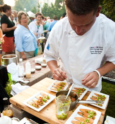 Chef Davin Wardynski from 676 at the Omni Hotel prepared grilled bacon with honey lacquer and pea shoots.