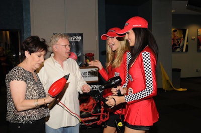 Models dressed in raceway gear welcomed guests.