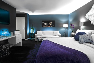 Suites done in a basic color palette include pops of purple.