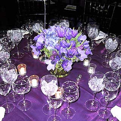 Susan Edgar Design created simple centerpieces of purple flowers.