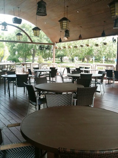 The covered patio has numerous suspended lanterns for ambient lighting and can accommodate 120 for events.