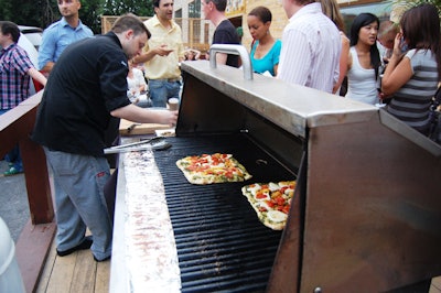 Staff from the Food Dudes grilled meat, seafood, and pizza on the venue's patio.