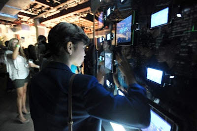 A 9- by 9-foot video wall comprised of iPads and iTouch screens presented interactive information about the new hybrid vehicle.