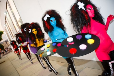 In addition to body paint, models wore teased wigs, tall boots, and very little clothing.