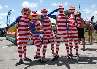 Five guys dressed in American flag bodysuits posed for photos.