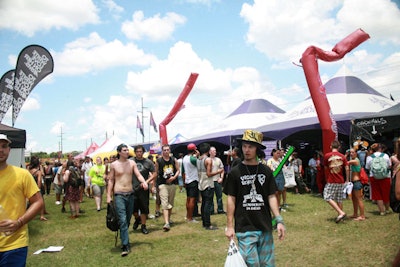 Sponsors arranged their tents and on-site activations in a village-style setup.