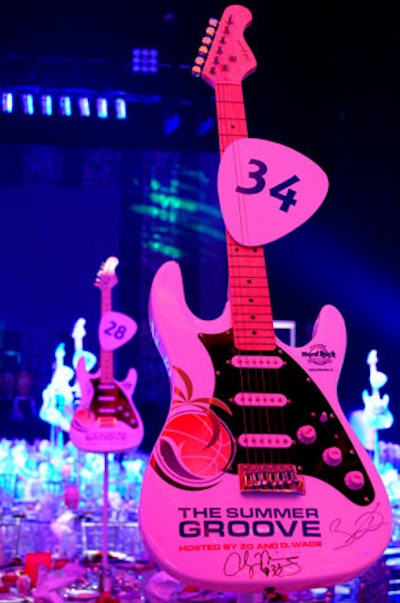 White Fender guitars branded with the event's logo and signed by Mourning and Wade served as centerpieces on the dinner tables before being sold in a live auction.