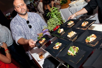 Guests sampled Au Soleil Catering's flatbread with goat cheese, mushroom, summer squash, and red onion.