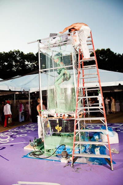 Janosch Parker's 'Tornado Machine' was a live performance that splashed the artist with paint while he turned inside a transparent cubicle.