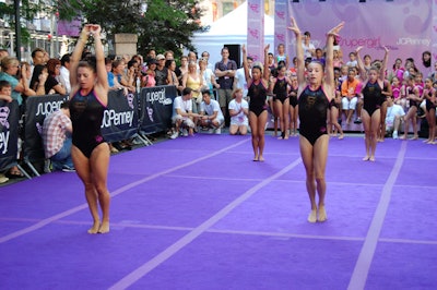 To show off the Supergirl by Nastia leotards, J.C. Penney brought in a troop of gymnasts to flip and leap before the gathered audience.