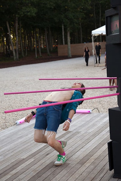 The artist (I think) demonstrates his (her? hard to be 100 percent sure) limbo sculpture on the plaza at the Watermill Center. Earlier, tipsy girls in party dresses drank, danced, and spilled things. Fun!