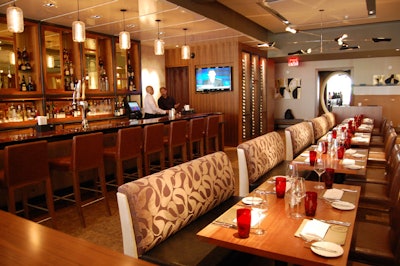 Cocktails and small plates are served at the spacious bar.