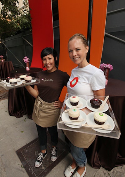 Wearing branded T-shirts, servers circulated with trays of Sprinkles cupcakes.
