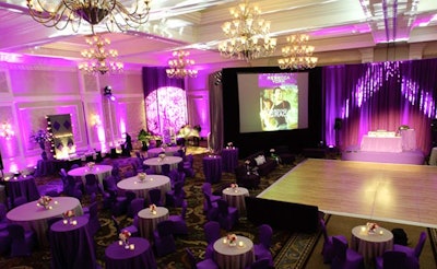 At the start of the party, two large screens at the front of the ballroom displayed images of Harlequin book covers.