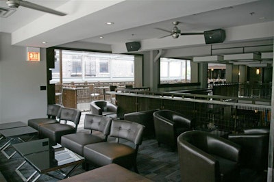 The sports bar houses lounge areas filled with leather furniture.