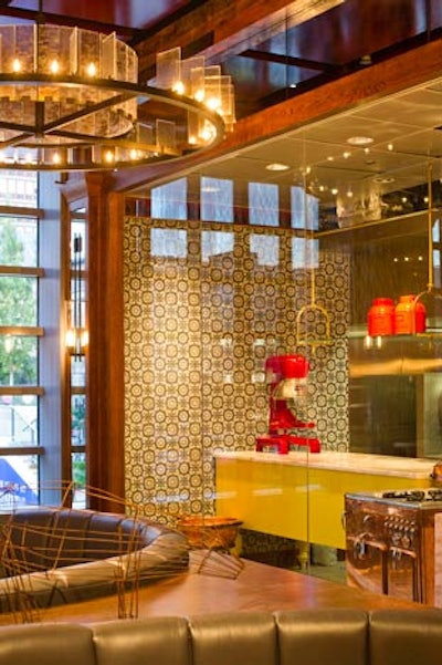 The upstairs dining room offers a peak into the glass-encased exhibition kitchen.