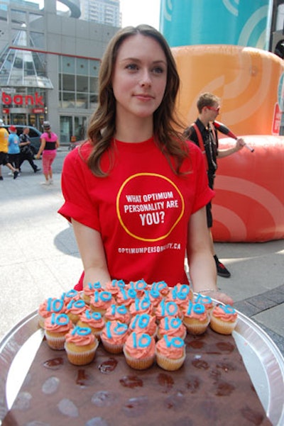 Passersby could sample birthday cupcakes decorated with the number 10.