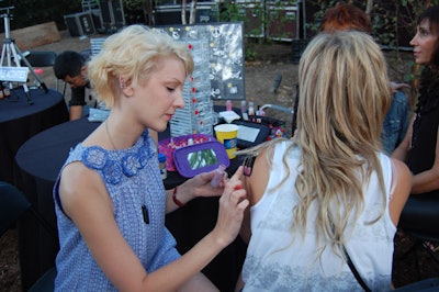 Guests could get an airbrush tattoo at a booth staffed by artists from Freshcoat.