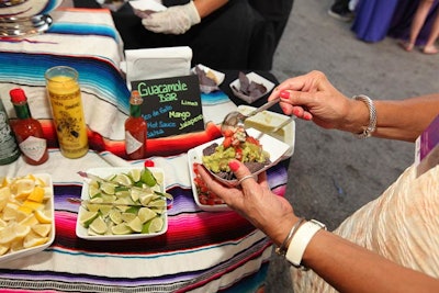 In the Mexican tent, guests loaded chips with guacamole and pico de gallo.