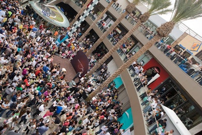 A crowd surrounded a small stage where a ceremony marked the grand opening on August 6. Joe Moller produced.