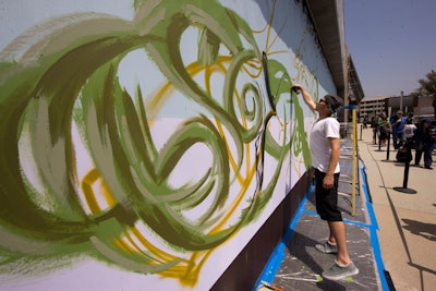 An artist painted a mural meant to represent the fresh, organic offerings in the market, set to open at Santa Monica Place in 2011.
