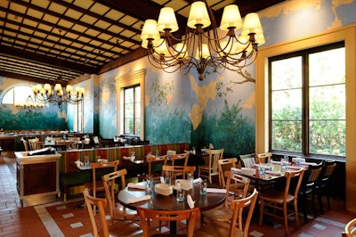 Landscape murals adorn the walls of Via Napoli's main dining room.