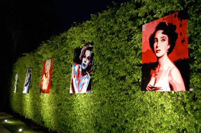 Artist Elisabetta Fantone's portraits of movie stars like Marilyn Monroe, Elizabeth Taylor, and Judy Garland lined a hedgerow in pool area.