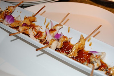 The V&E Group served chicken skewers with teriyaki sauce and other passed hors d'oeuvres.