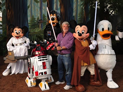 Movie creator George Lucas posed for photos with Disney's signature characters in Star Wars costumes.
