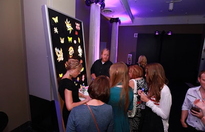 In an area bathed with black light, guests got temporary tattoos of butterflies and Chinese characters.