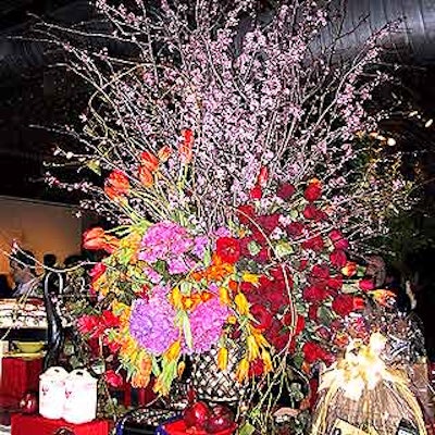 Saundra Parks of Daily Blossom created a giant, gorgeous floral display with tulips, roses, hydrangea, anemone and cherry blossoms for the main auction display table.