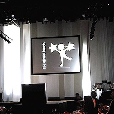 The stage was a simple black set washed in white light.