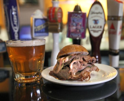 National Pastime Sports Bar and Grill served a steak sandwich with homemade onion sauce, paired with Loose Cannon IPA, a Maryland craft brew.