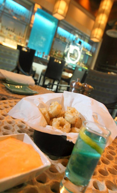 Moon Bay Coastal Cuisine served crispy calamari with a citrus emulsion alongside a Moon Bay breeze cocktail.