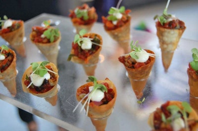 Hors d'oeuvres from Daniel et Daniel Event Creation & Catering included a roasted tomato tartare in a mini wonton cone with Parmesan crème fraîche and micro basil.