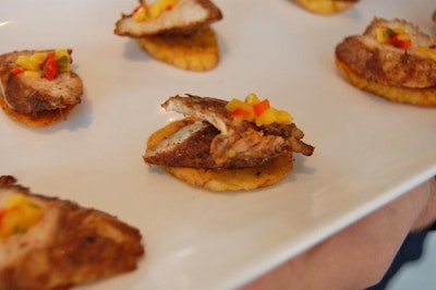 Servers passed a selection of appetizers, including spicy grilled chicken served on a plantain crisp and topped with salsa.