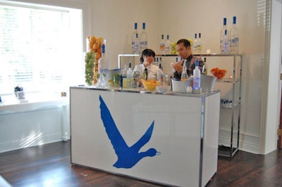 Servers offered pear and orange flavoured Grey Goose cocktails at a branded bar in the great room.
