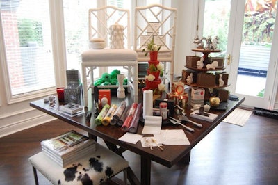 AT Design Group showcased gift ideas like candles, decanters, and biodegradable napkins with a display in the sun room.