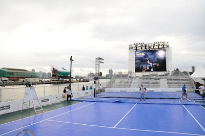 The 48- by 88-foot court comprised a custom engineered level deck, two layers of plywood, one layer of shock absorbing rubber, and a final layer of Sport Court.