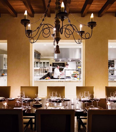 Inside the custom European kitchen at the Montage Beverly Hills, an intimate chef's table for 12 overlooks the adjacent Beverly Cañon Gardens.