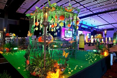 At the center of the Parkway, a skirted platform held a gazebo area with hanging flowers and candles, ivy, copper pots, and a fountain.