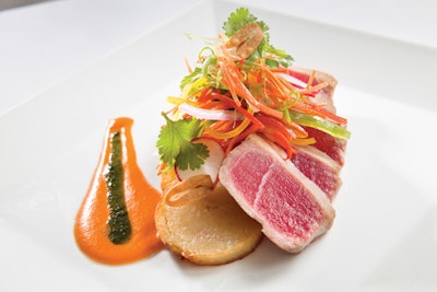 Pan-seared ahi tuna with fondant potatoes, vegetable escabeche, and citrus vinaigrette from Lyon & Lyon in Miami