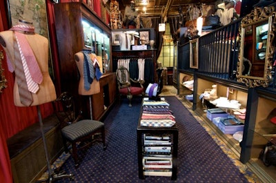 The store's merchandise includes shirts, suits, ties, and overcoats for men.
