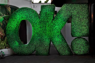 A logo topiary served as a dramatic decor piece at OK magazine's fifth anniversary party.