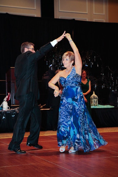 Share the Care board members demonstrated their dancing skills before being auctioned off to dance with an attendee.