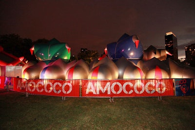 Lines formed outside the Luminarium. From British company Architects of Air, the cocoon-like, dimly lit structure holds a maze of glowing areas. Its makers bill it as 'an inflatable, walk-in sculpture.'