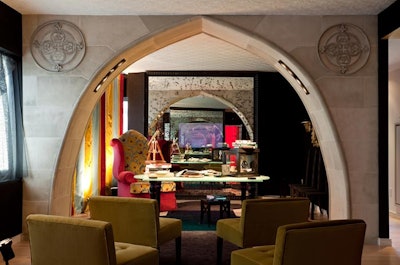 In the 'Great Room,' Keith Baltimore of the Baltimore Design Group custom built a faux stone archway out of foam, and elaborate fabrics and furniture channel The Borgias, the network's follow-up to The Tudors.