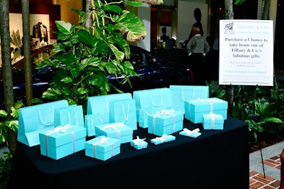 Tiffany & Company set up a table version of its signature gifting wall, with its blue boxes and bags each sold for $100 and containing jewelry of various prices.